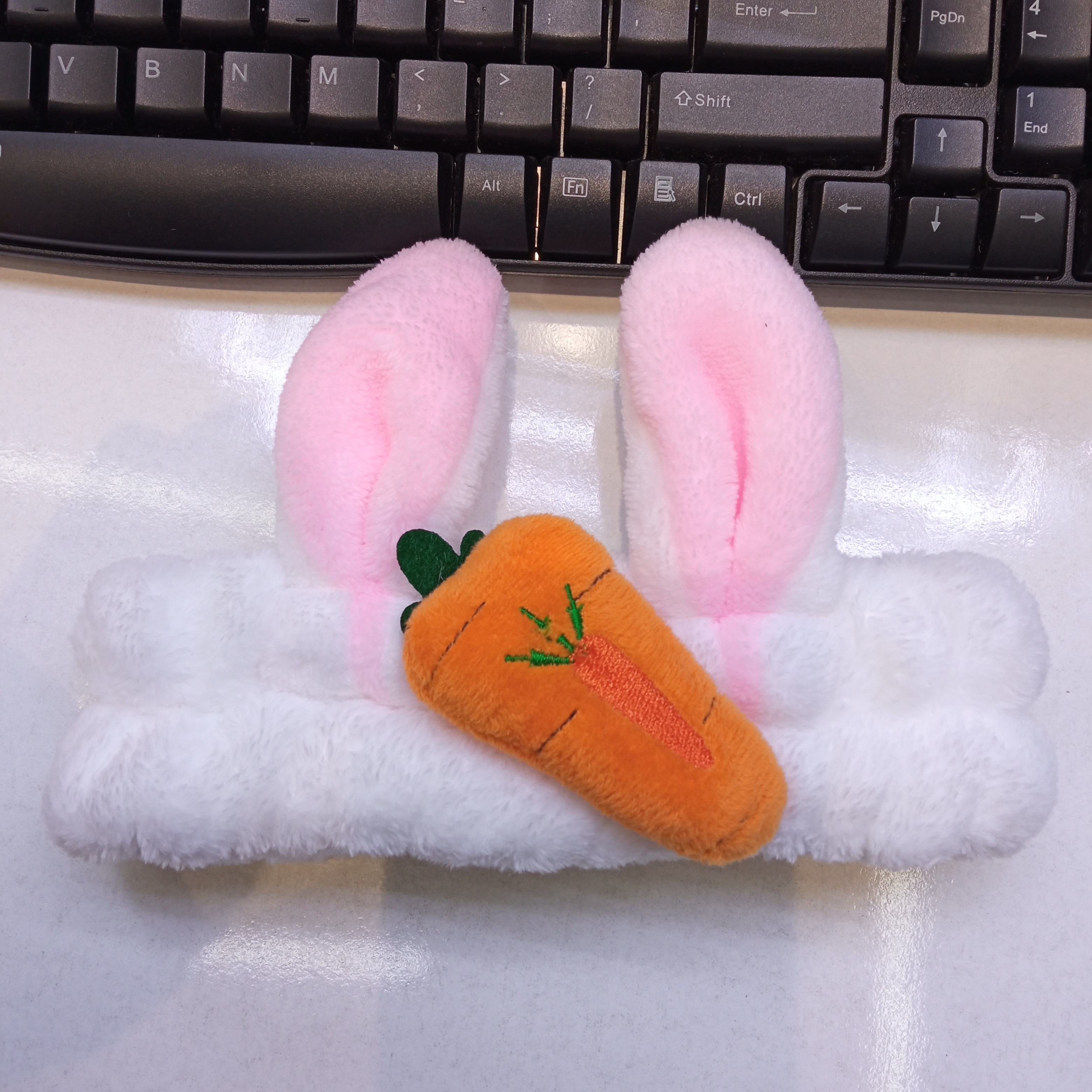 Carrot, rabbit ears, face wash and hair tie detail image 2