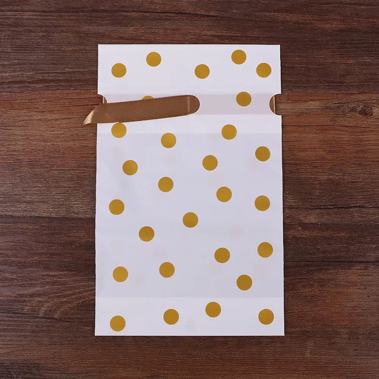 12*17 drawstring bags with 50 golden dots each