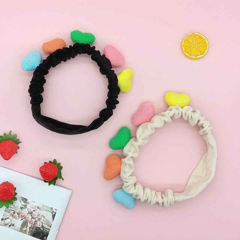Five colorful heart-shaped facial cleansing and hair binding bands