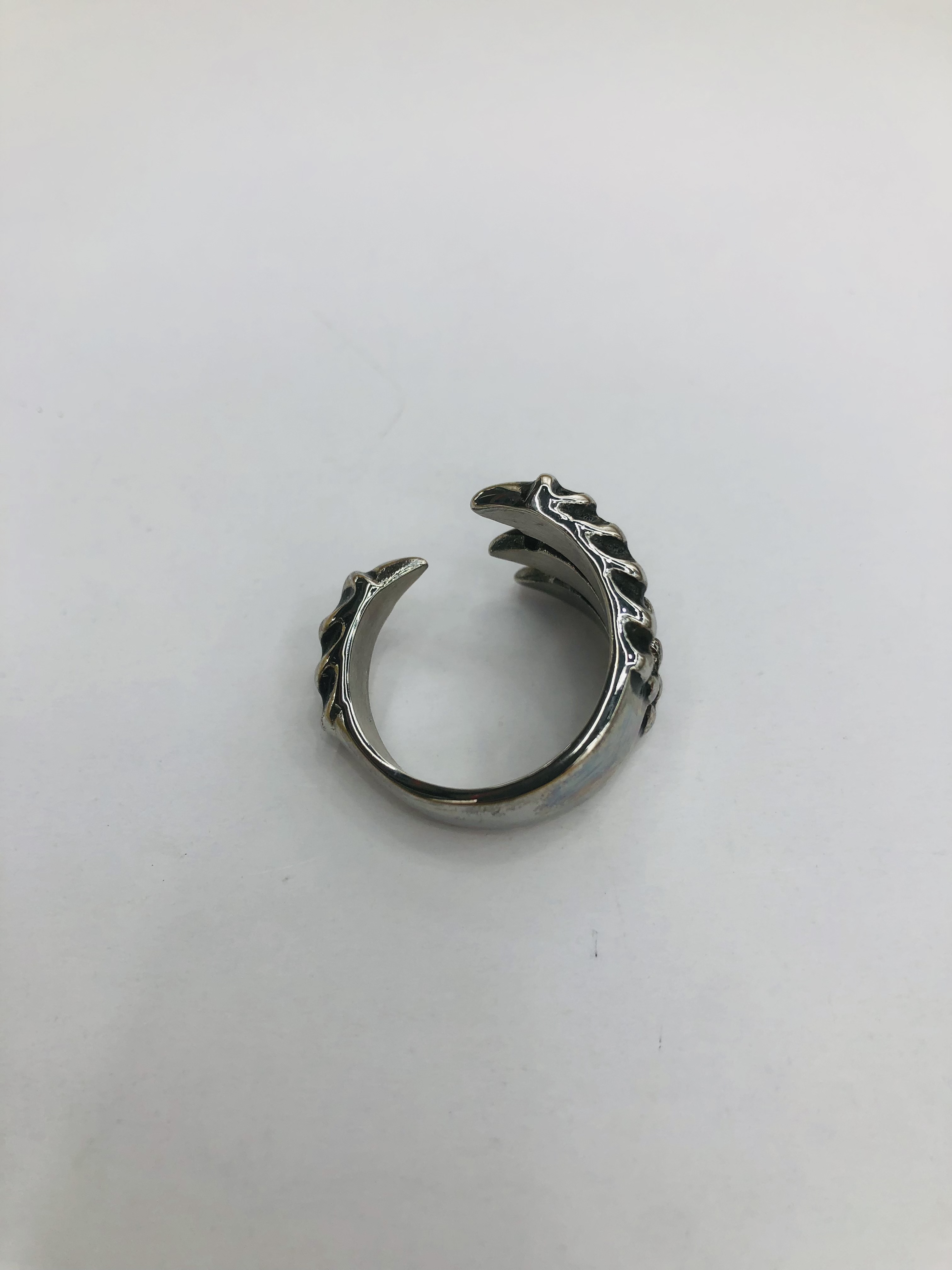 A stainless steel ring with a popular element claw design shape detail image 5