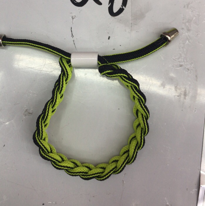 Green and black shoelace bracelet