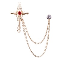 Cross chain brooch