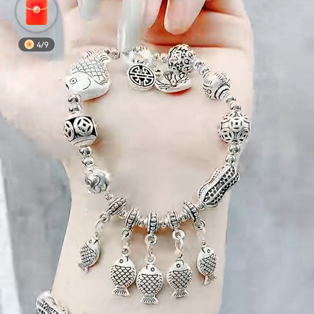 Silver bracelet hidden with many fish