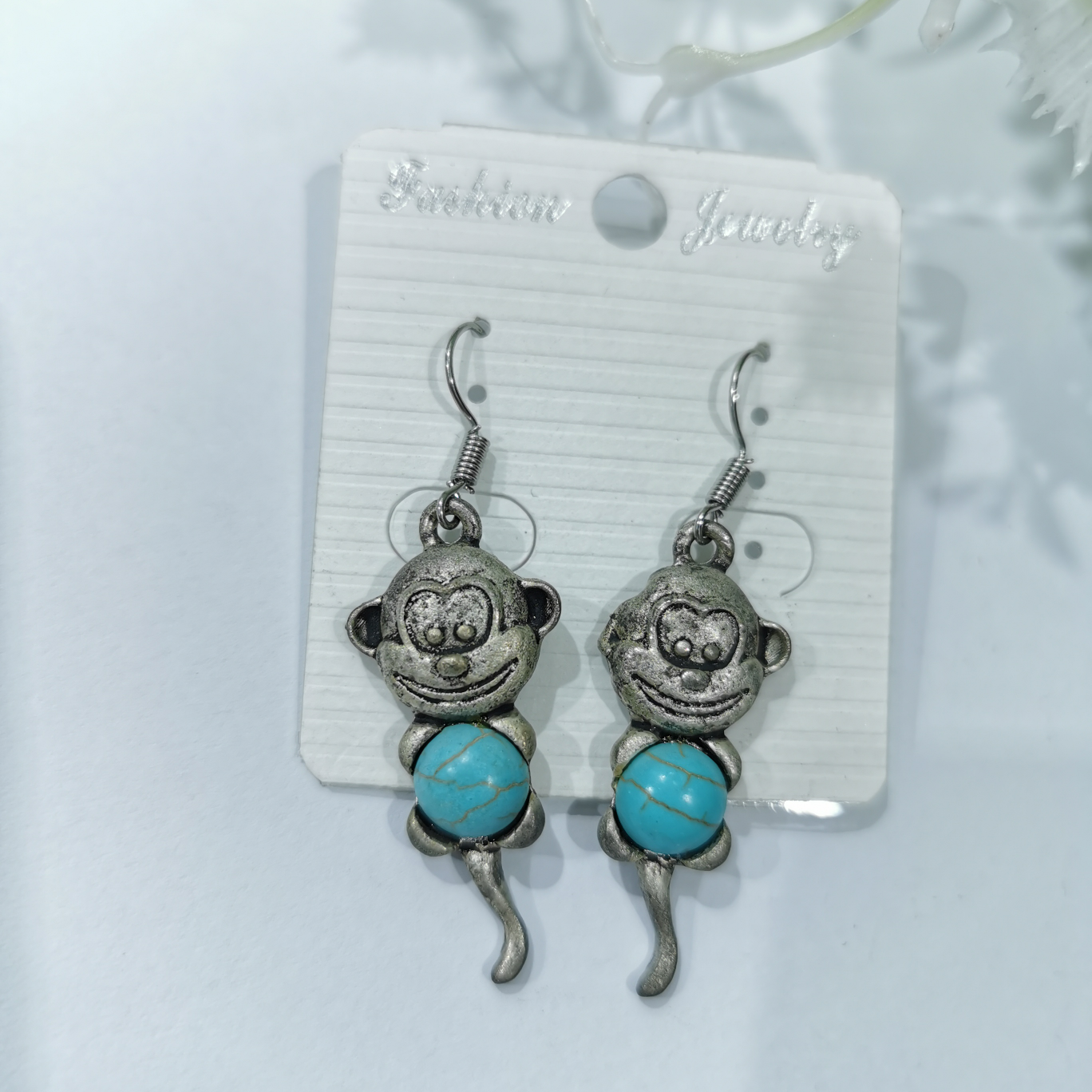 Small animal turquoise earrings