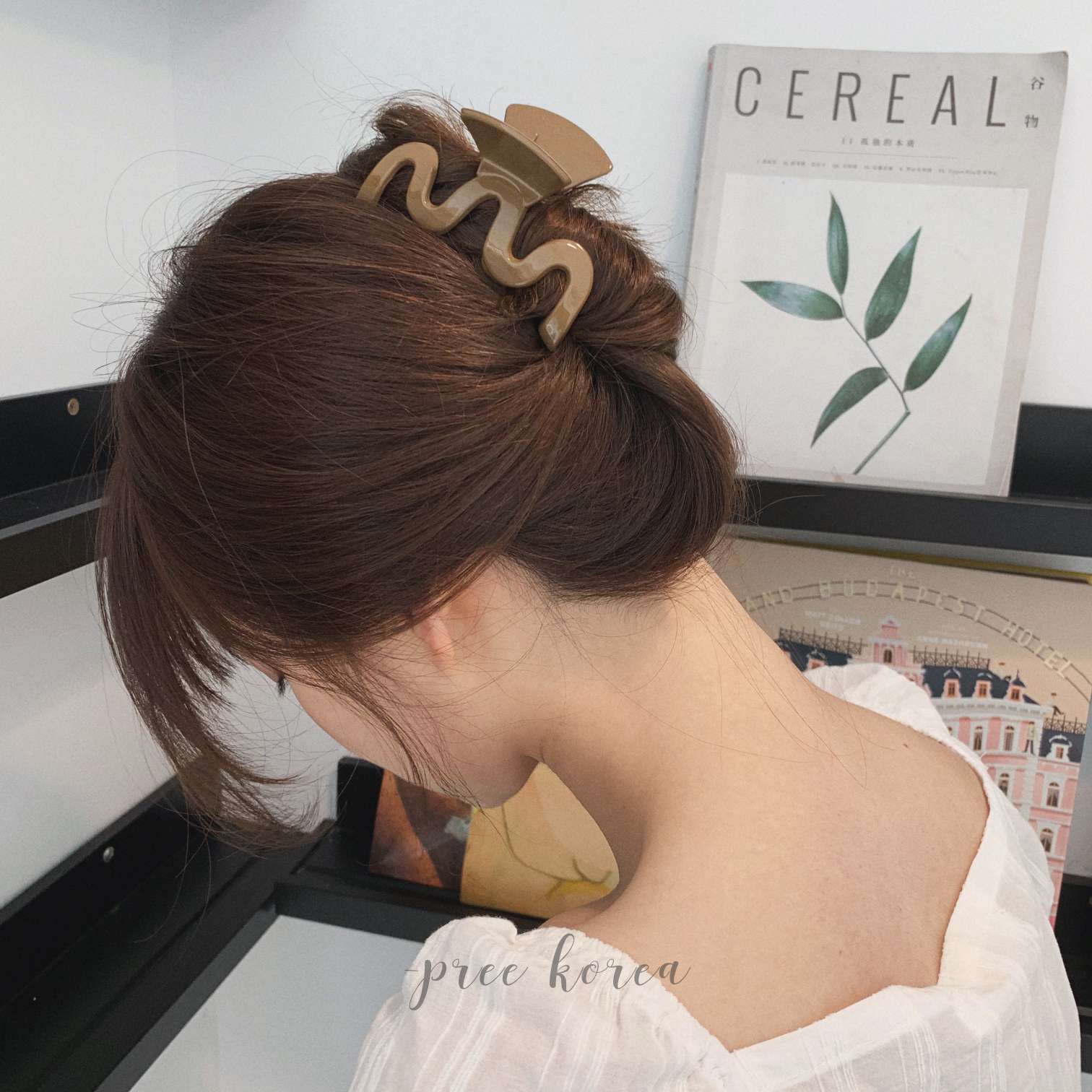 The minimalist artistic plastic hairpin clip at the back of the head in Dongdaemun, South Korea, with its laid-back lines details Picture