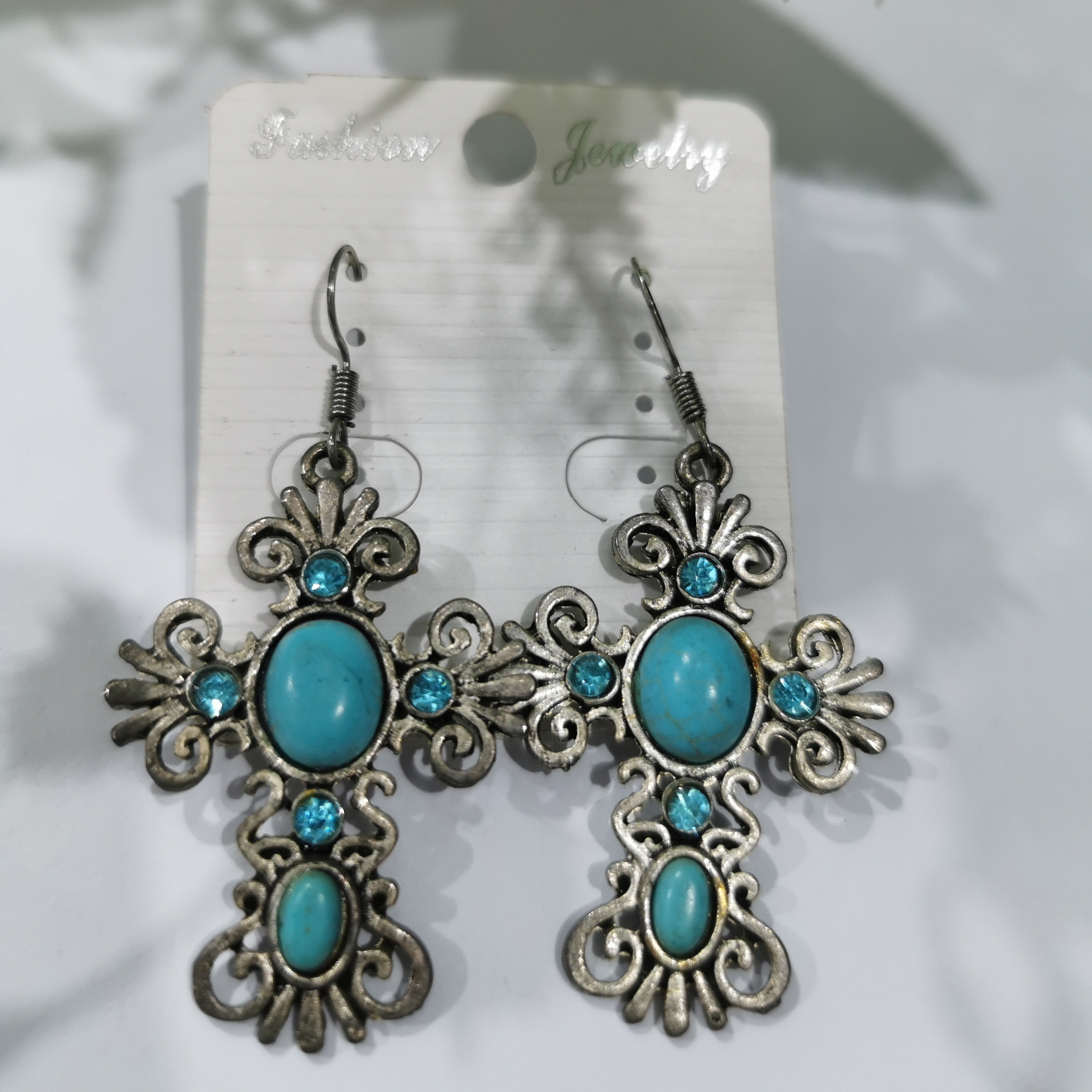 Diamond earrings with a cross
