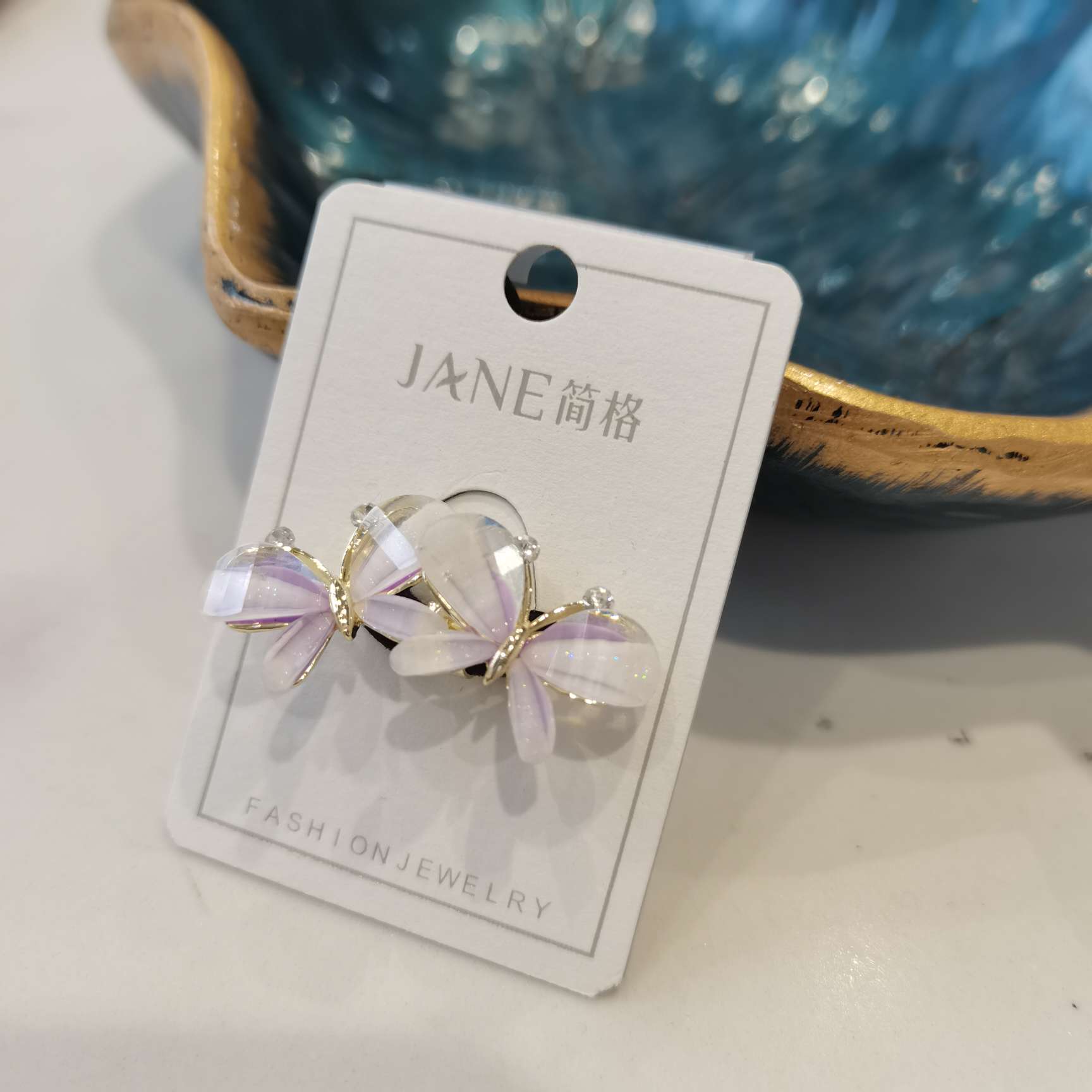 滴油环保彩色琉璃蝴蝶皮筋扣产品图