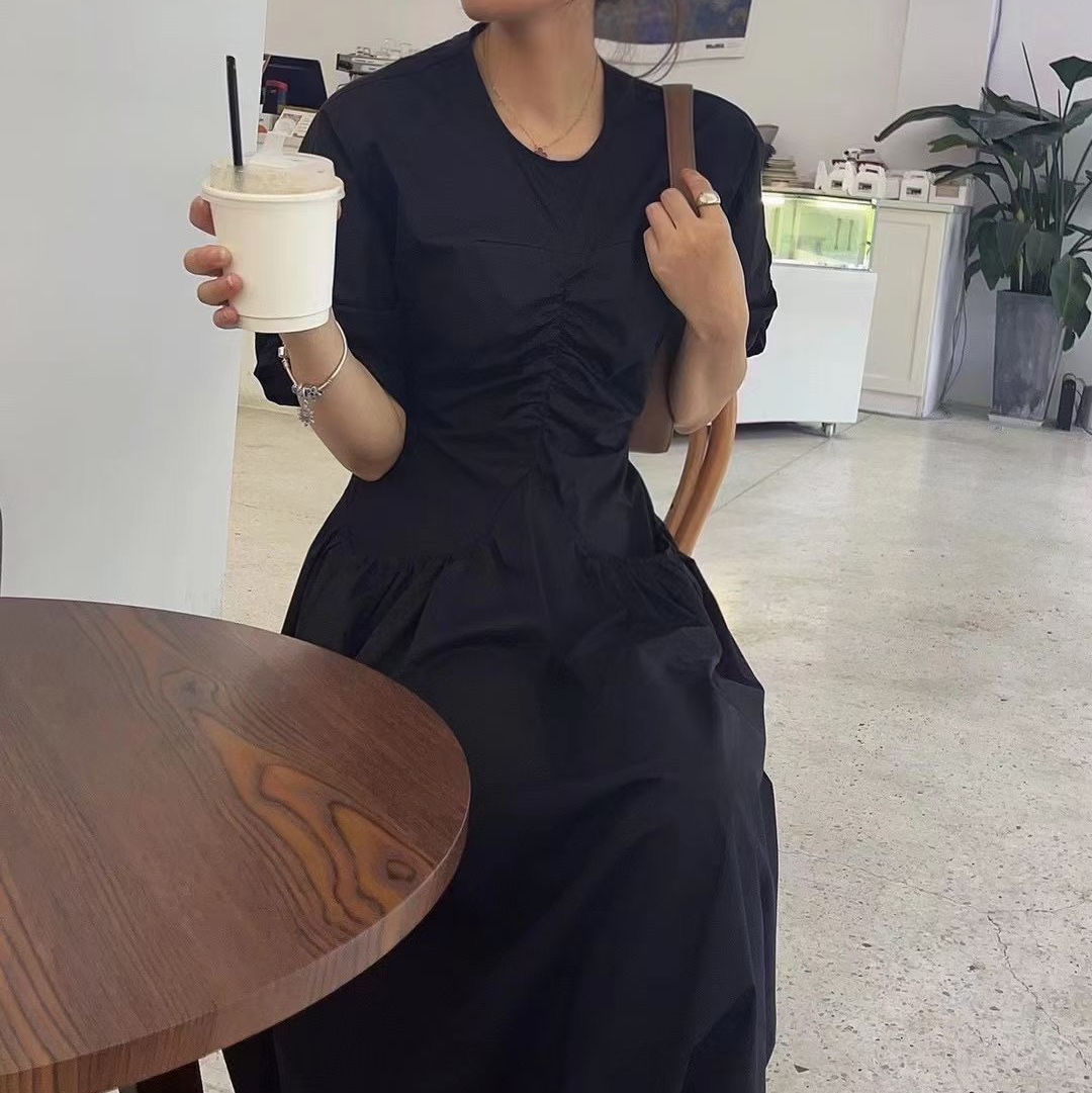 Black dress with V-neck.