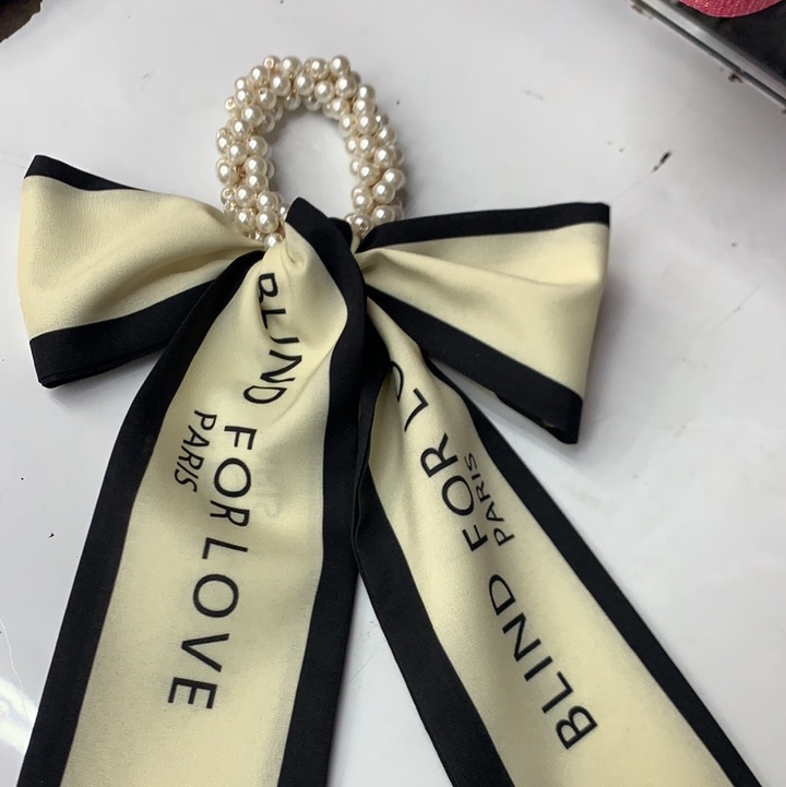 White Lettering On A Pearl Streamer