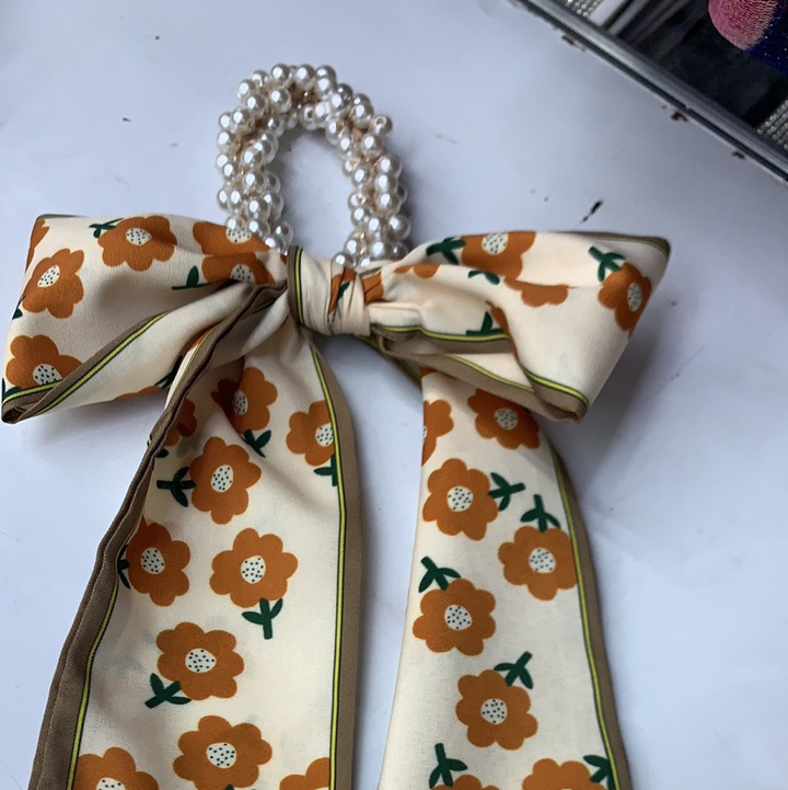 Small Yellow Flower With Pearl Streamers