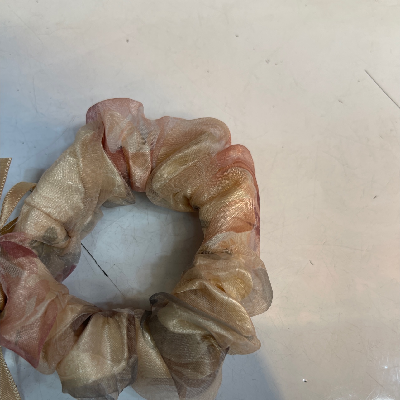 A coffee-colored ring in the floral fabric