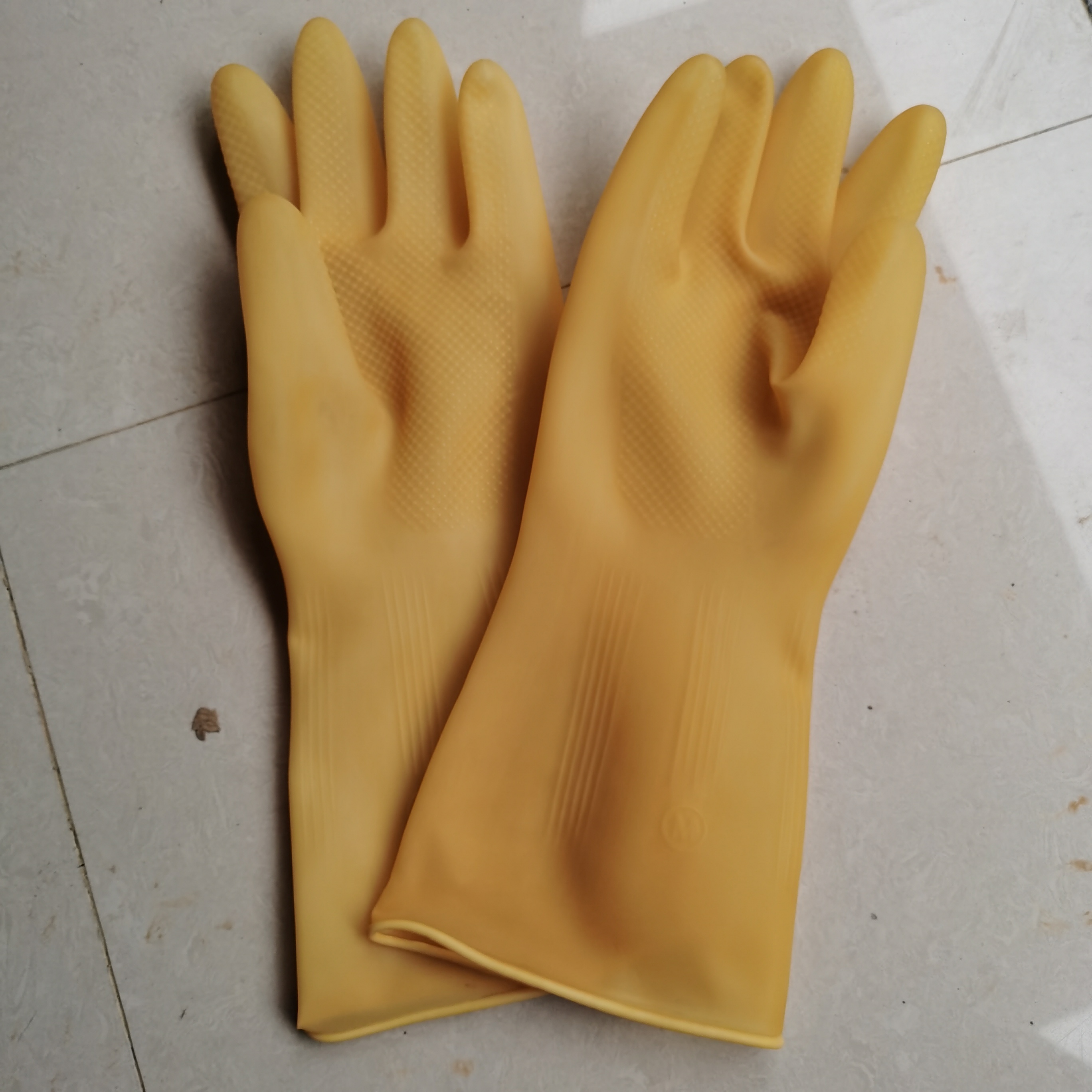 Yellow light inside latex gloves