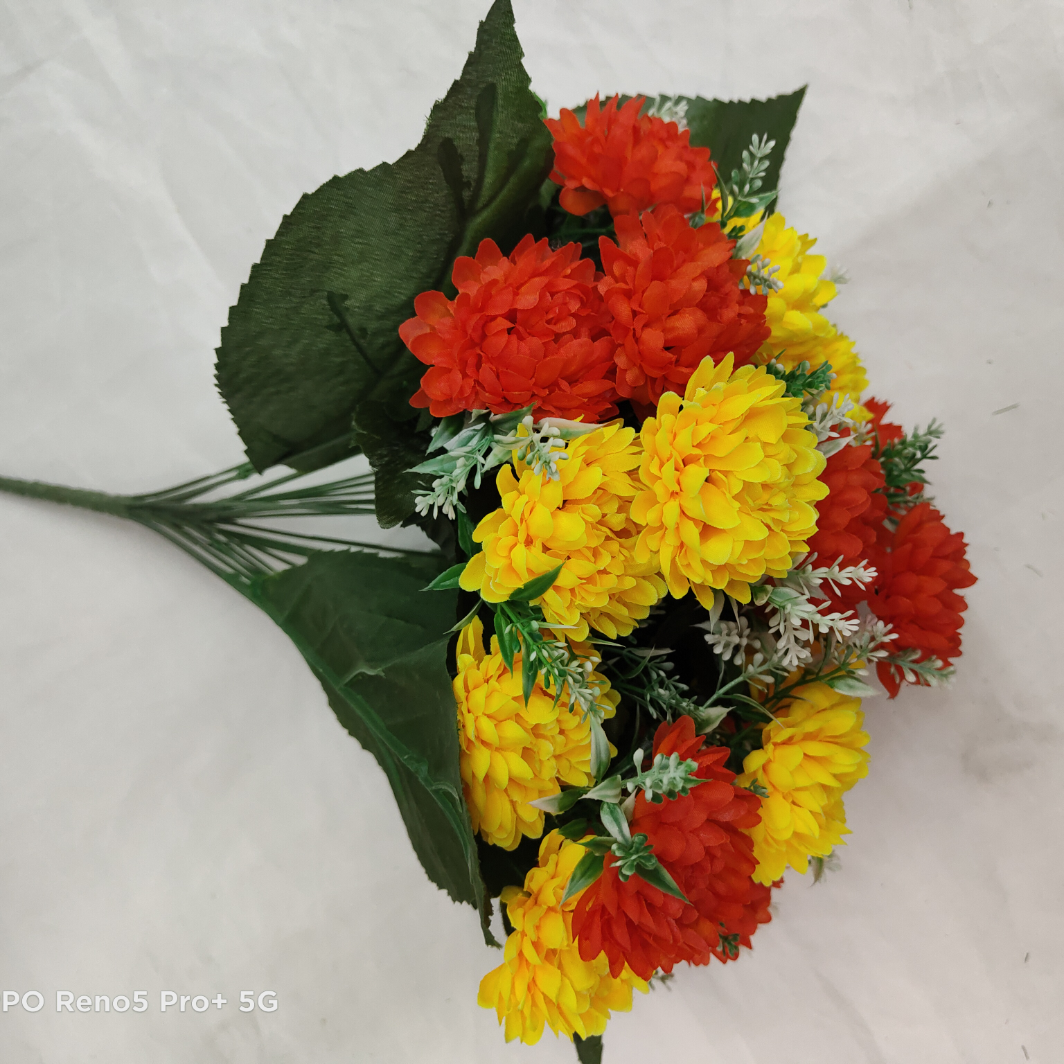 A combination flower with three leaves