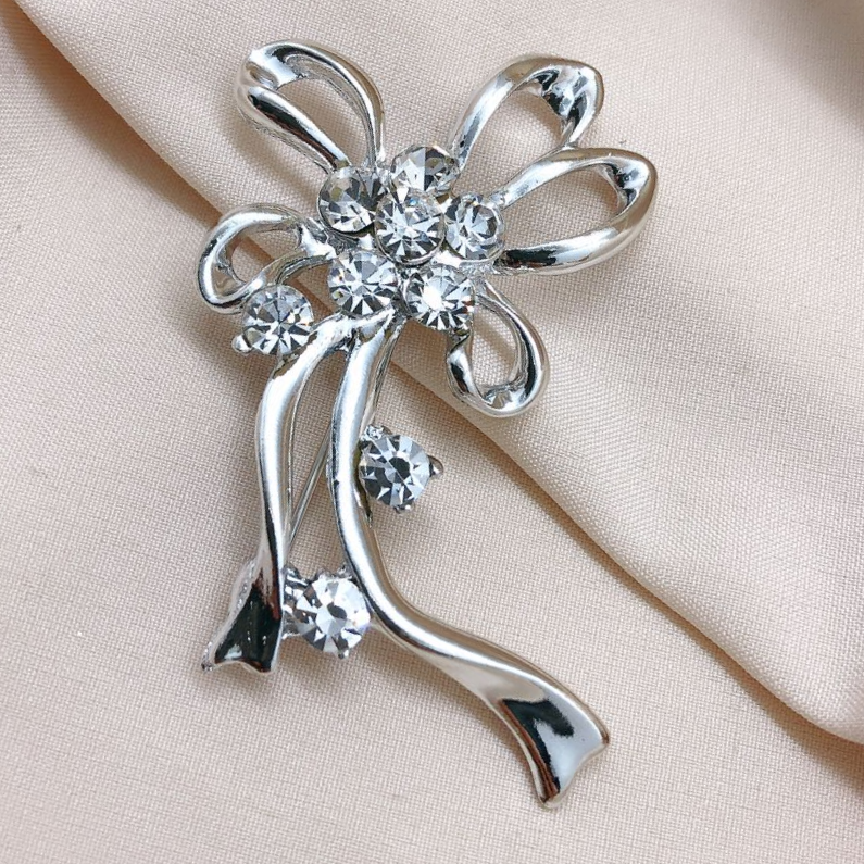 Bow style suit jacket brooch thumbnail