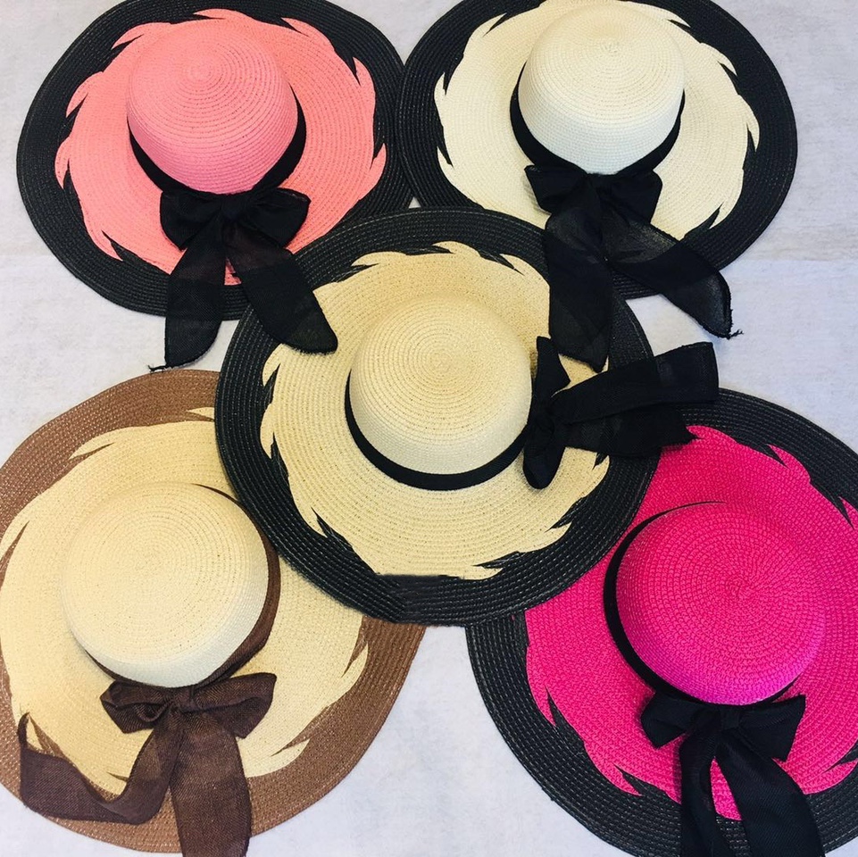 A Lady's Hat With A Large Brim