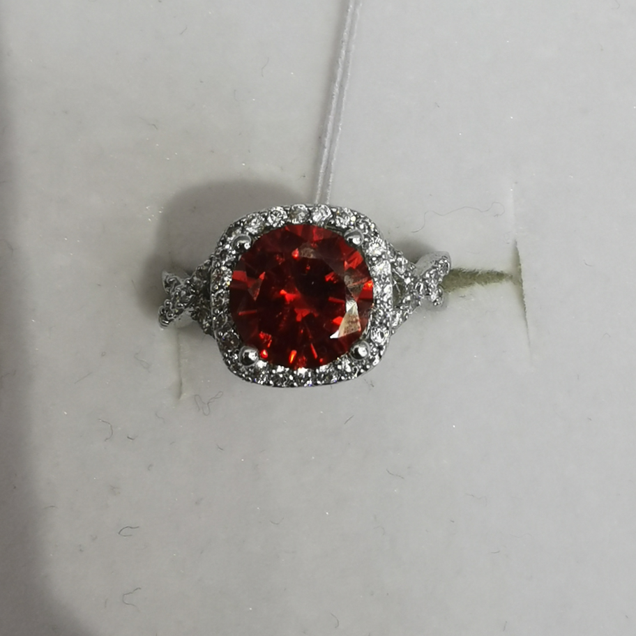 Red jewelry ring looking copper zircon