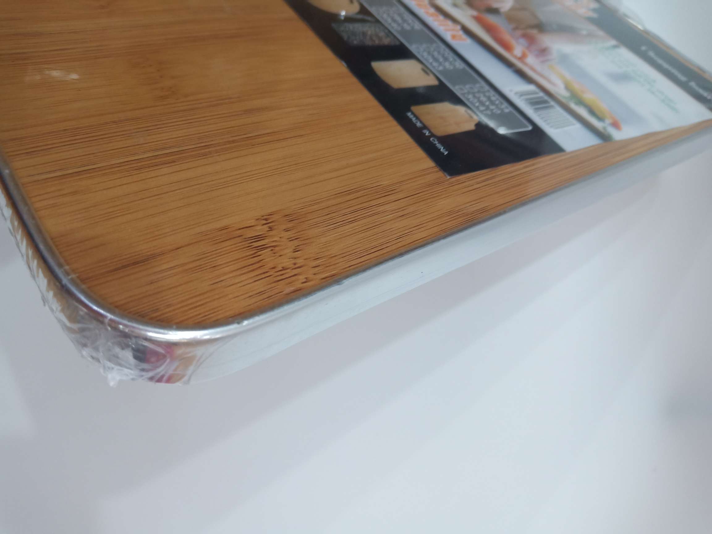 Rectangular bound cutting board with plastic handle Item Picture