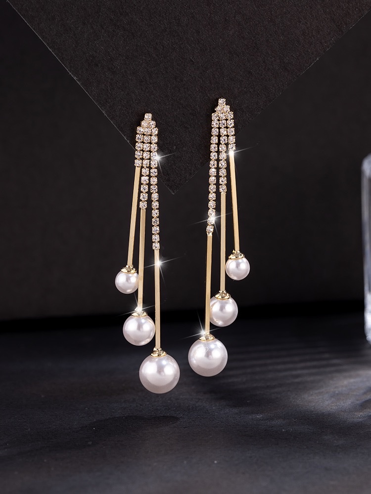 Cat's eye stone earrings, a trendy and stylish 2021 Korean fashion icon, are versatile long tassel earrings that can help slim the face detail image 1