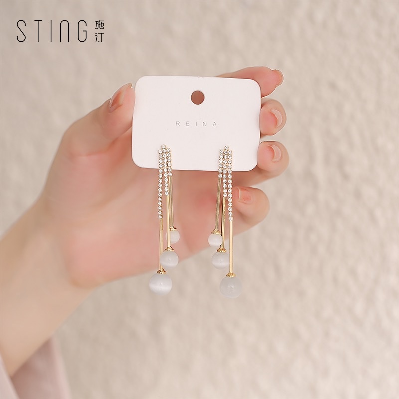 Cat's eye stone earrings, a trendy and stylish 2021 Korean fashion icon, are versatile long tassel earrings that can help slim the face detail image 5