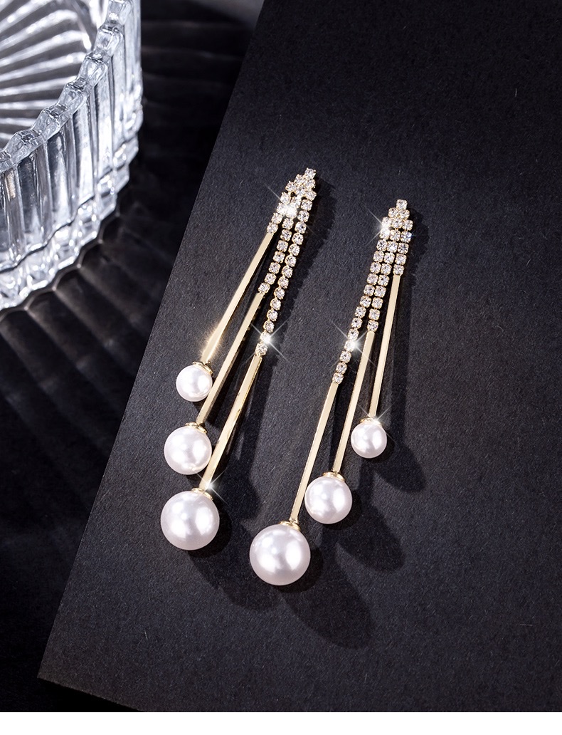 Cat's eye stone earrings, a trendy and stylish 2021 Korean fashion icon, are versatile long tassel earrings that can help slim the face detail image 4