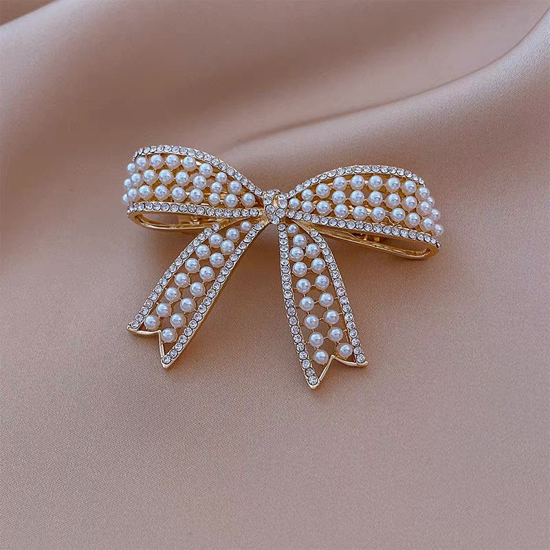 Design sense Pearl hair clip spring clip side 2021 new Korean pearl bow hair accessories