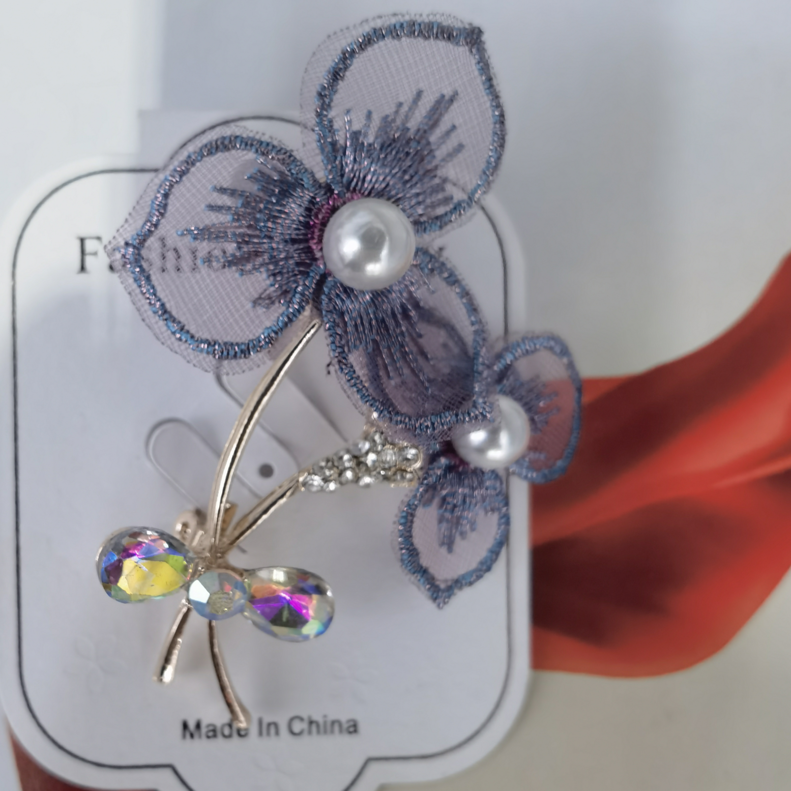 Two gauze flower brooches