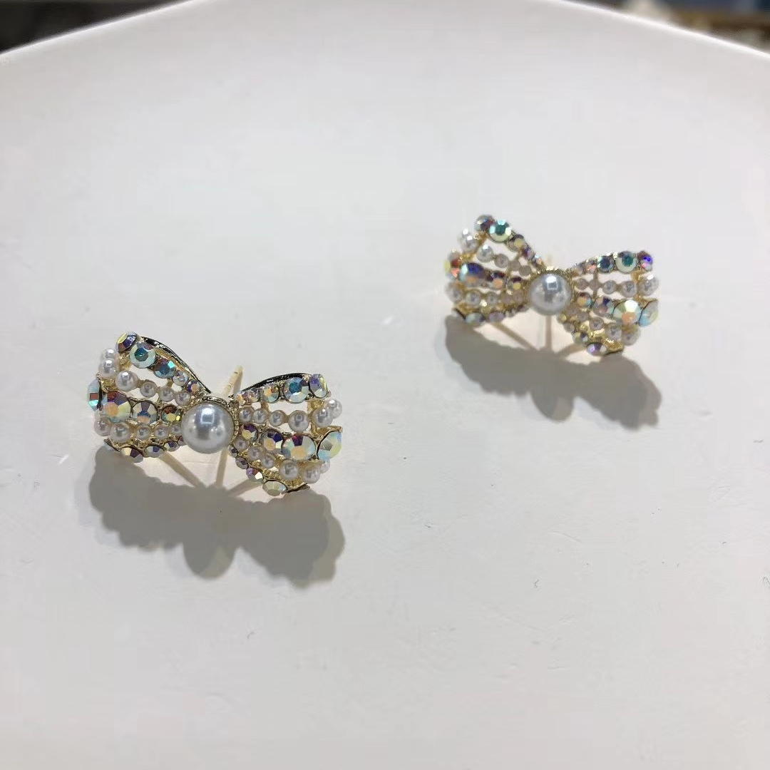 A new, stylish and simple pearl stud earring with a retro bow from Europe and America. It's a trendy and cool style earring for women on Instagram