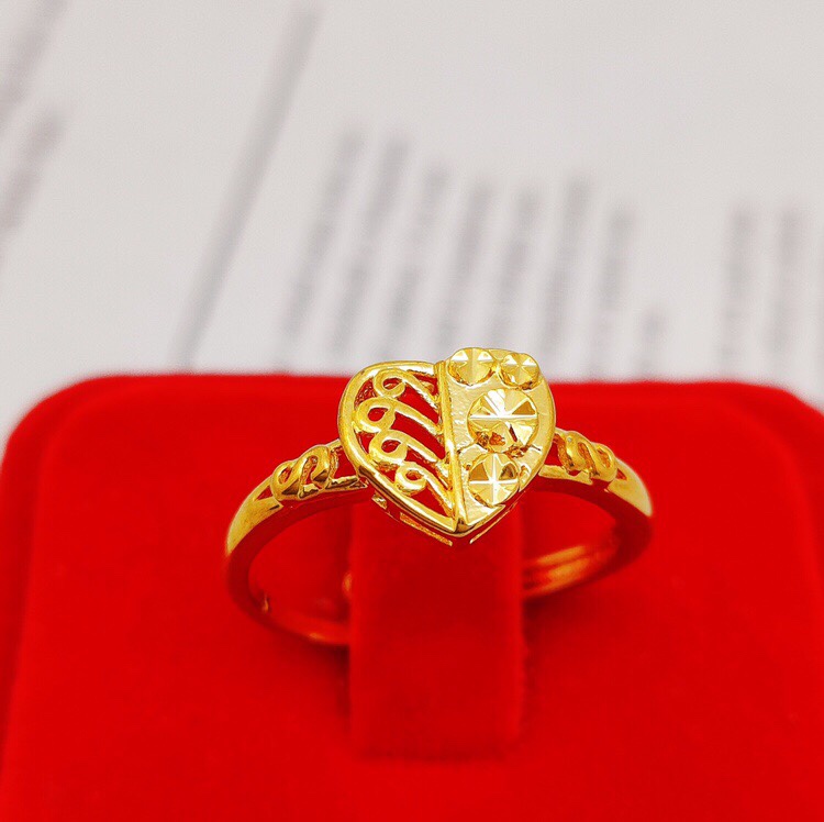A small ring with a heart half-cut,