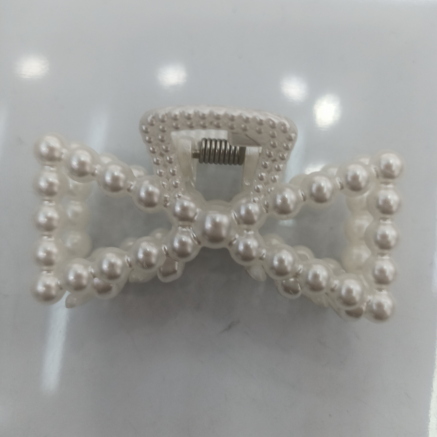 Large pearl bow tie with empty claw clip