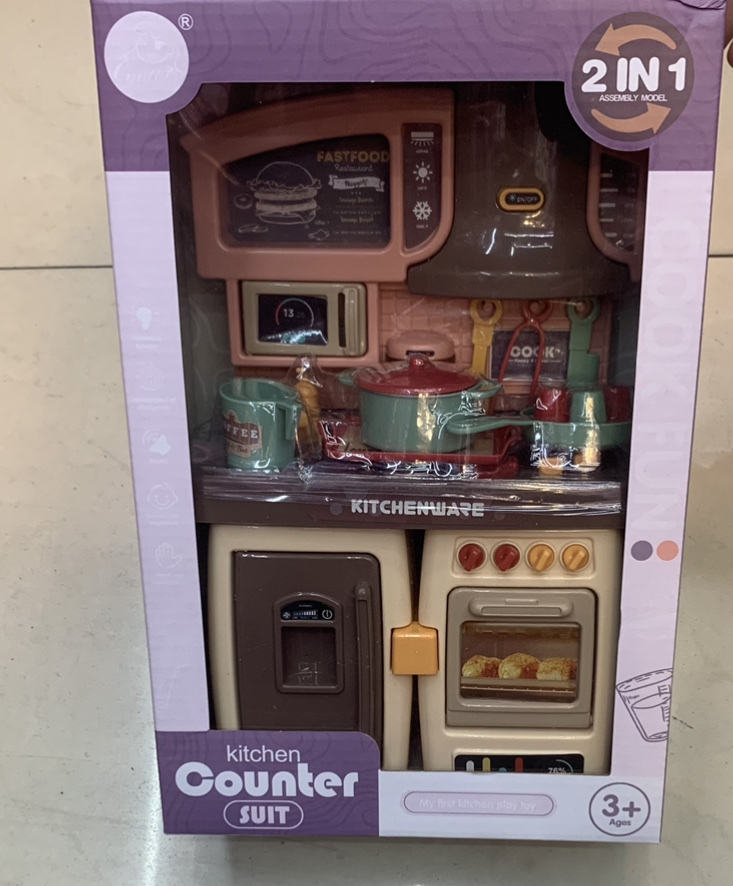 Little Kelly is pushing a Barbie doll pic 1