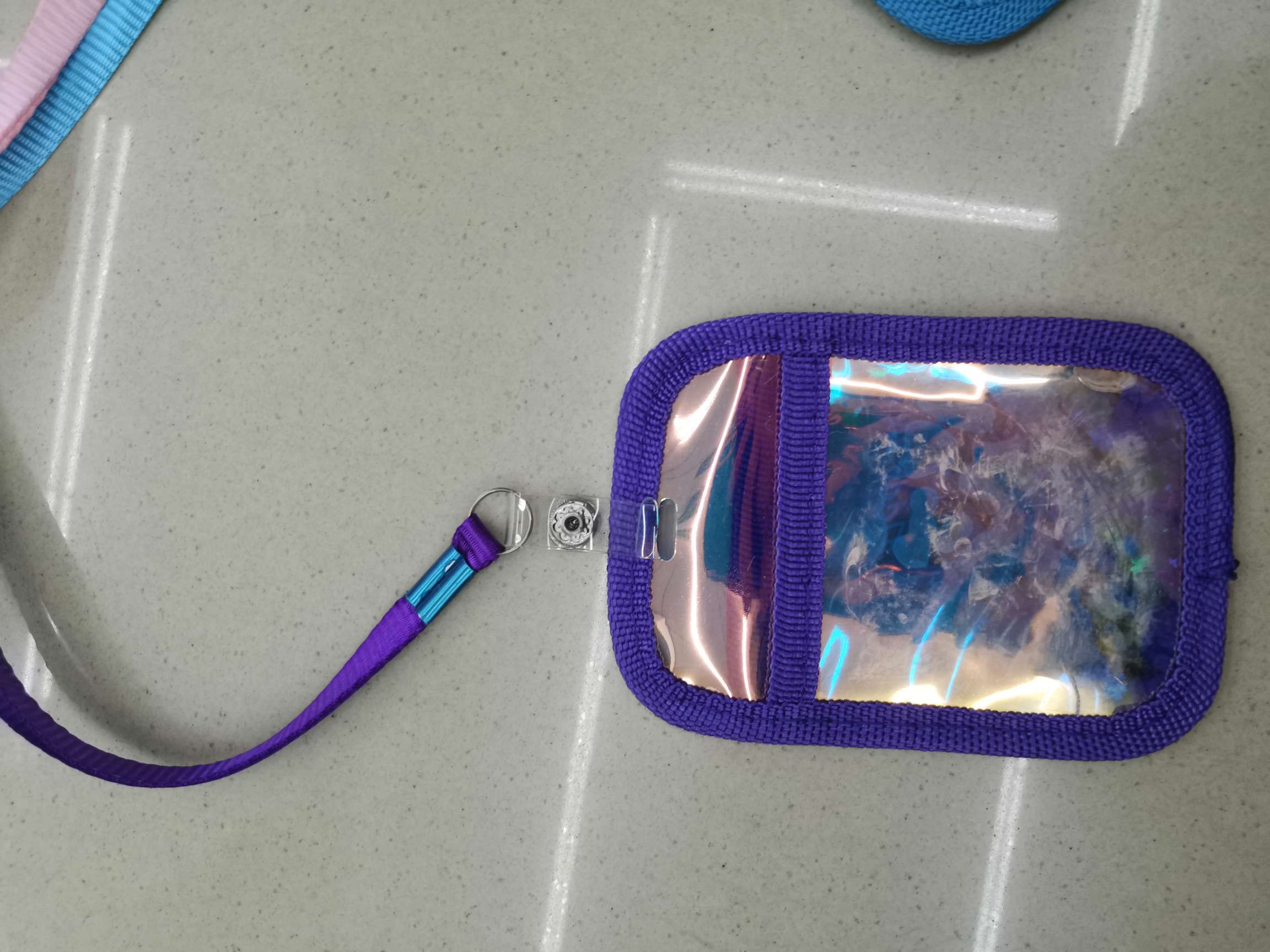 A color-changing card with a 1.0 band of purple details Picture