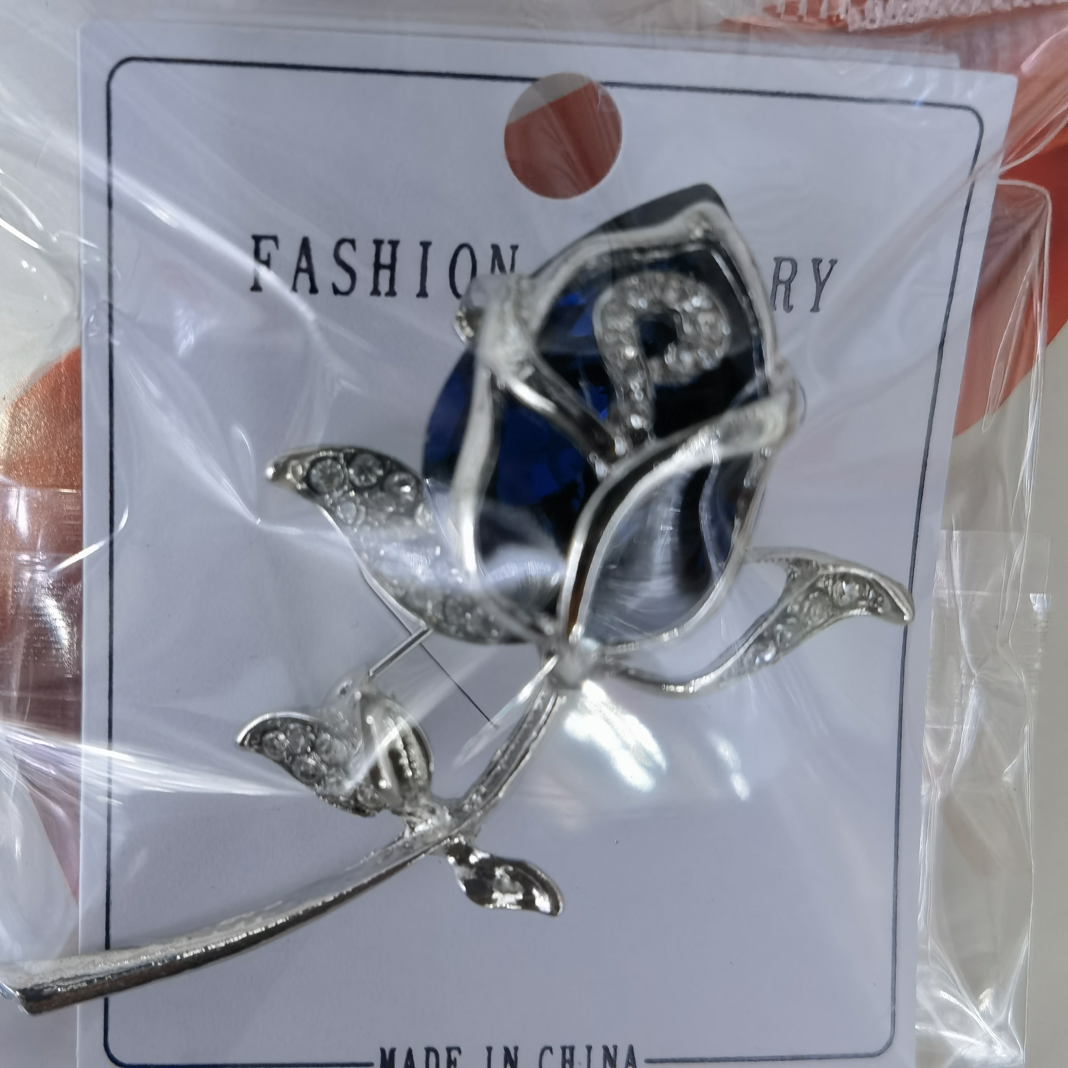 Blue glass rose temperament brooch