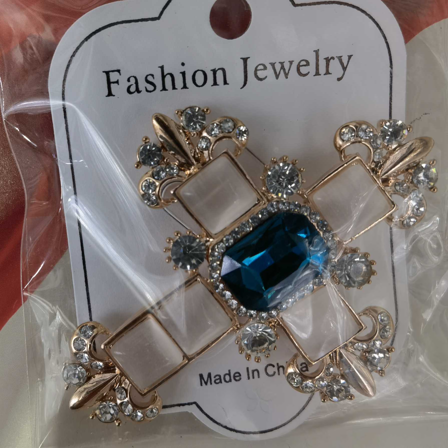 Opal cross brooch