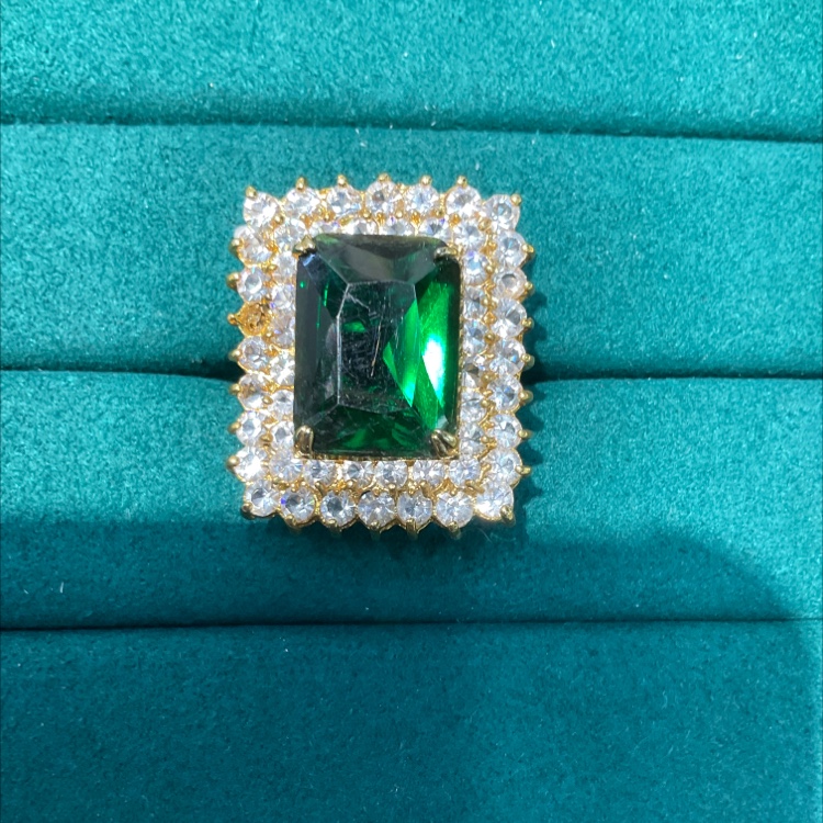 Natural emerald ring with micro-set diamond