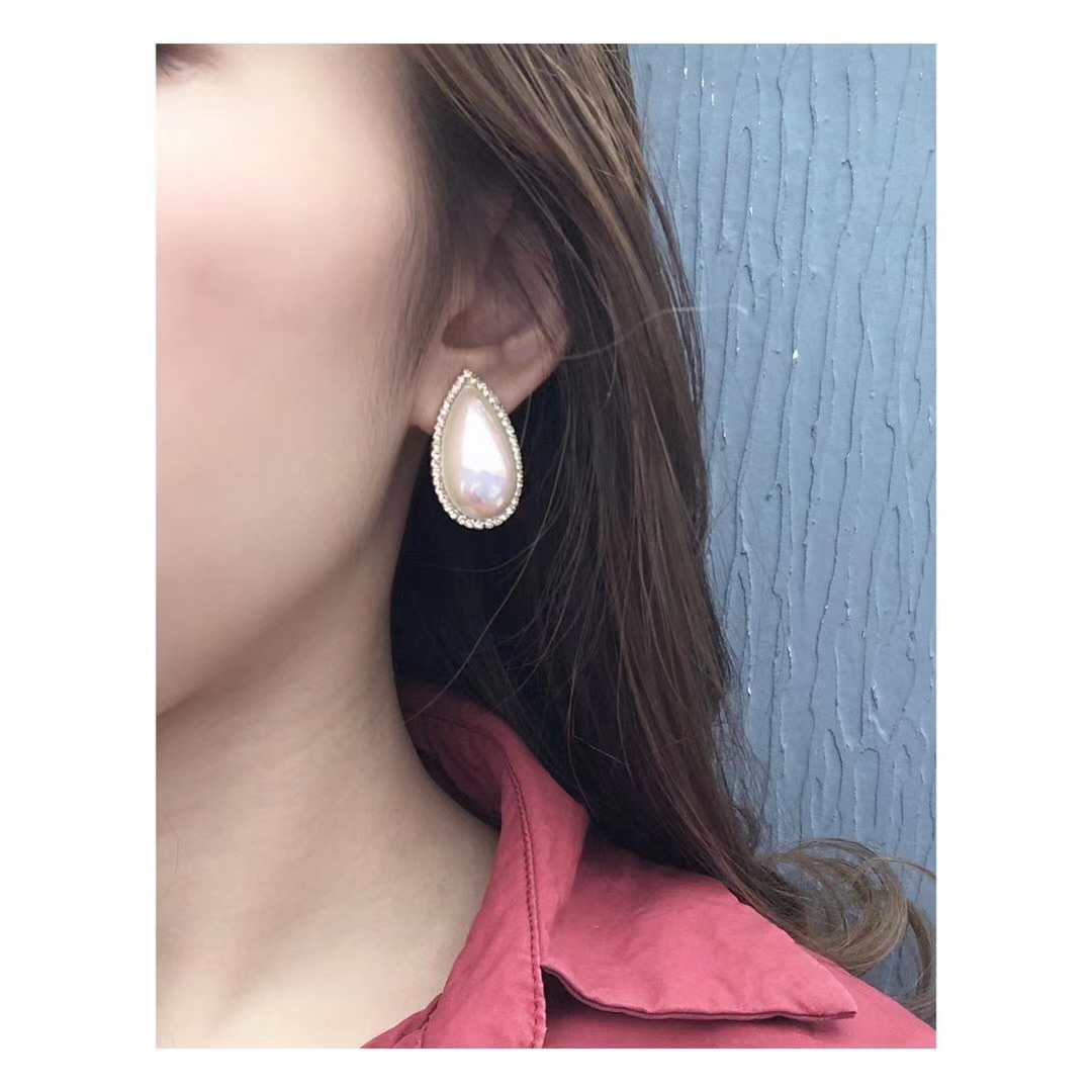 A girl wearing pearl earrings, vintage Western antique water drop large beaded, 925 silver stud earrings 1 Application Scenario