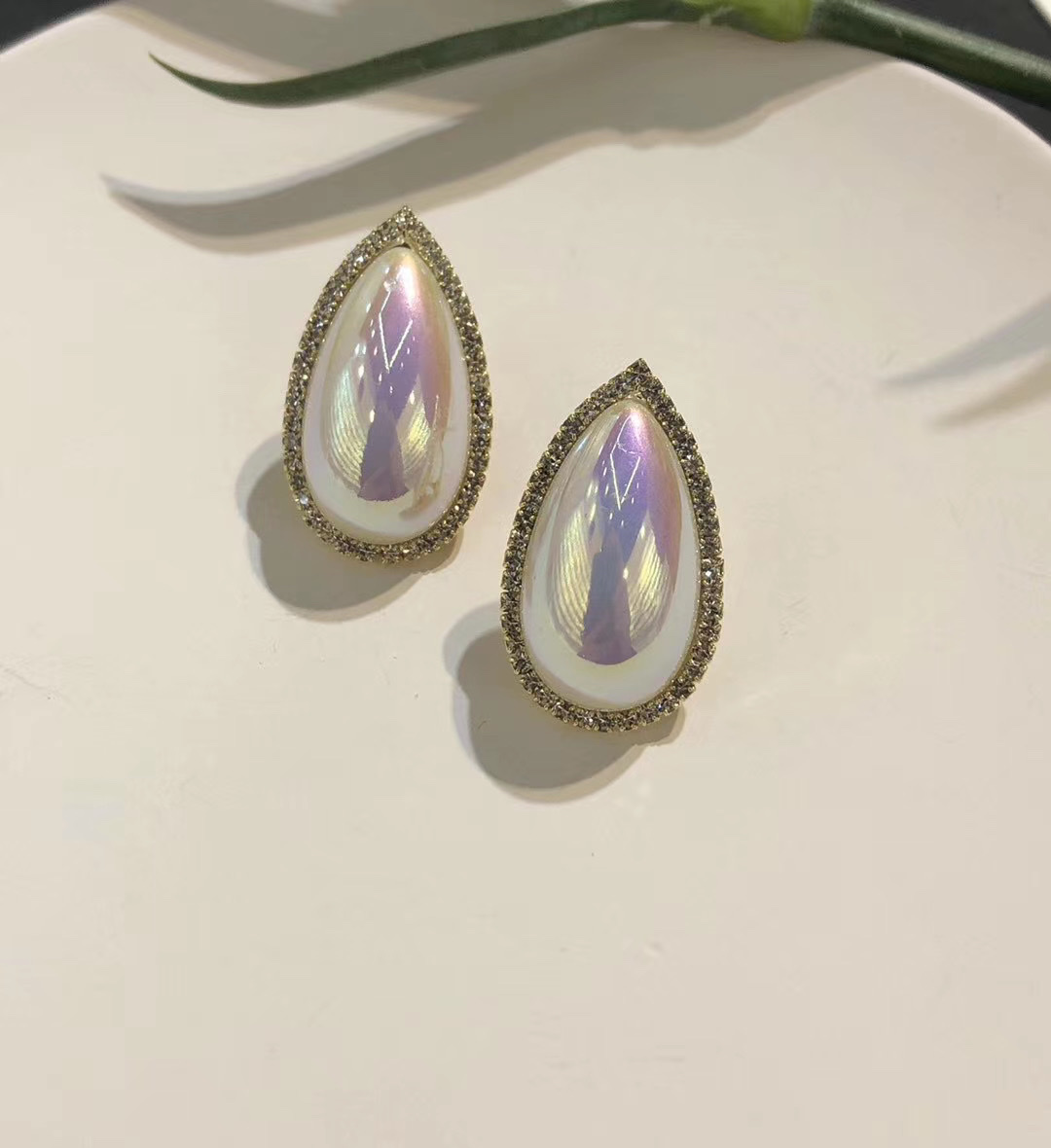 A girl wearing pearl earrings, vintage Western antique water drop large beaded, 925 silver stud earrings 1 details Picture