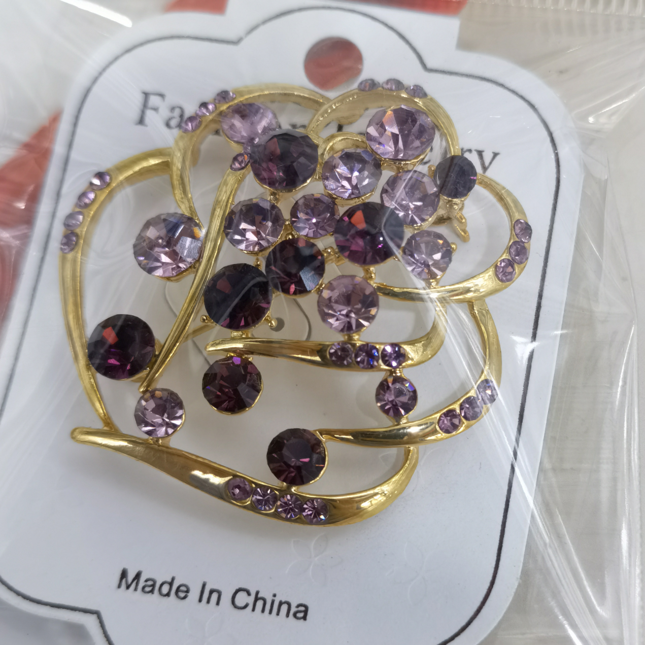 Colored diamond rose brooch