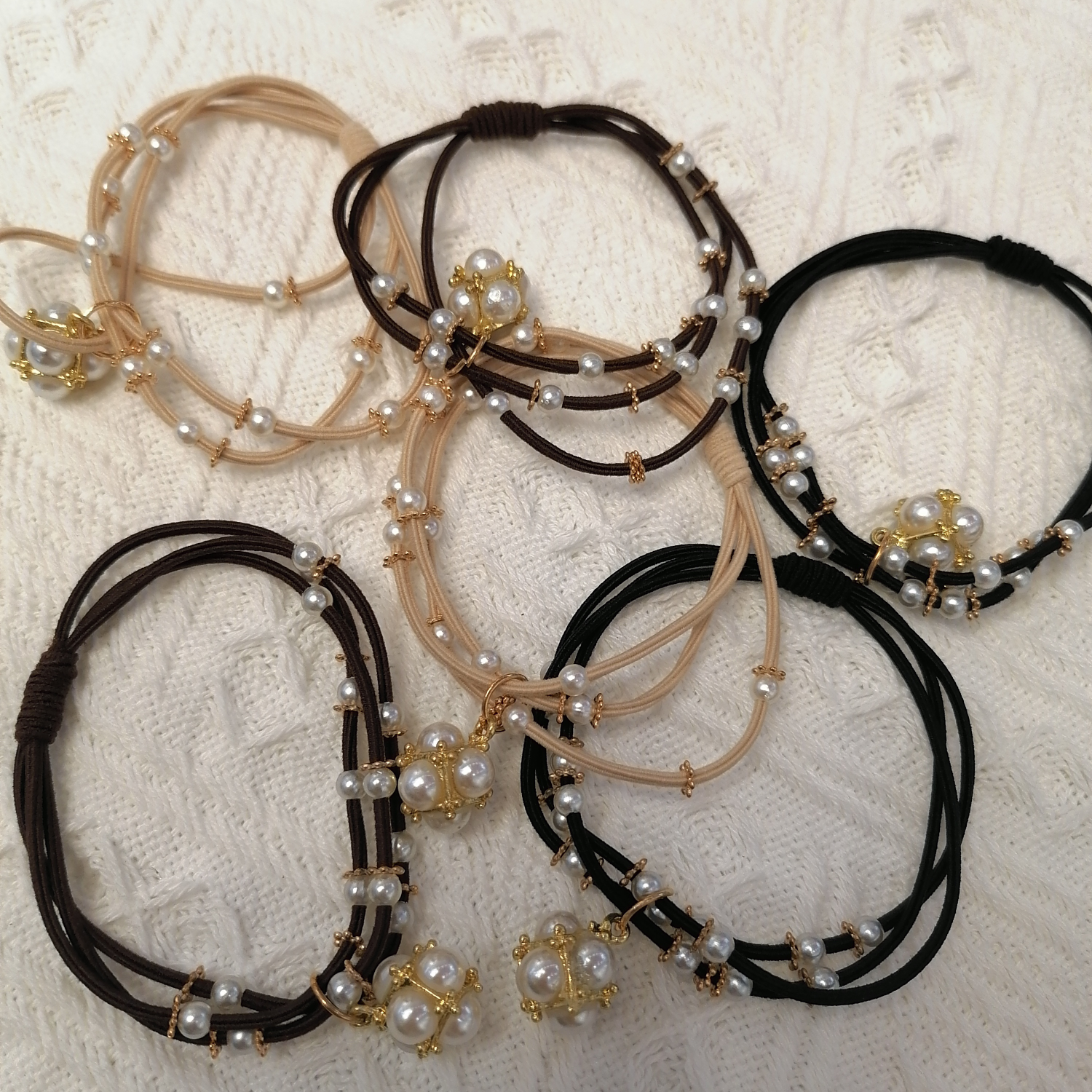A new minimalist hair tie and hair band for women with pearl-like beaded leather bands, a popular Japanese and Korean style headwear on Instagram, for summer