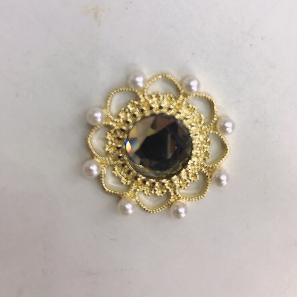 A large diamond in the middle of a round flower