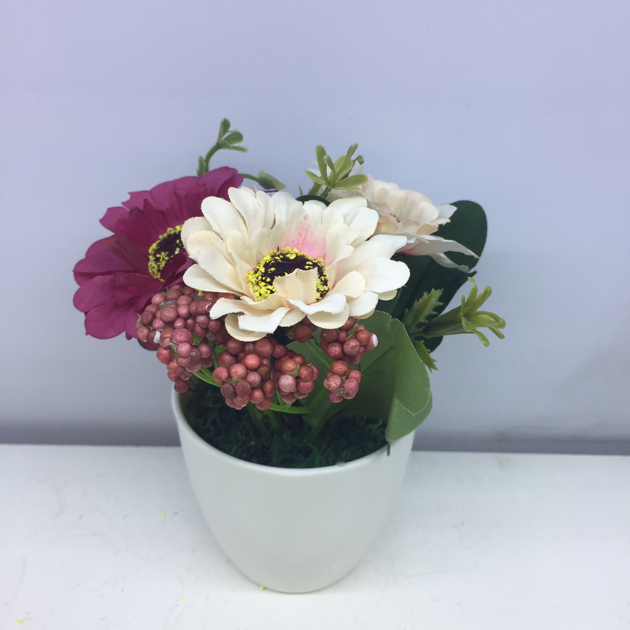 Plastic basin simulated flower arrangement piece