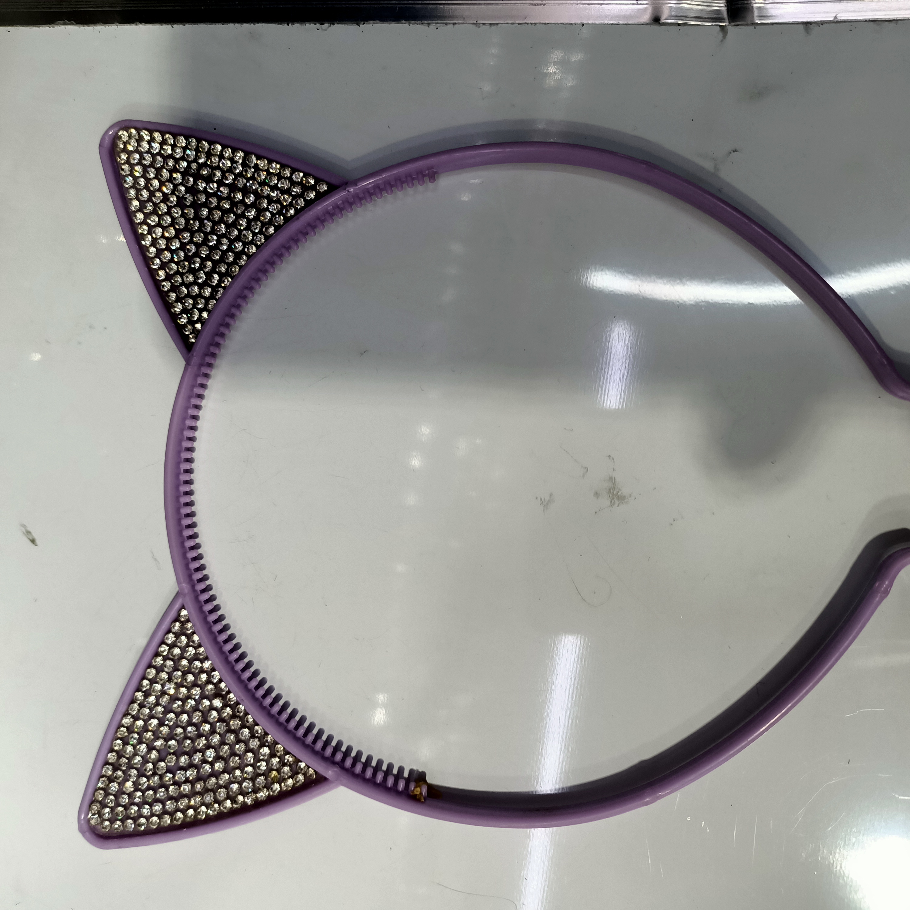 The cat has purple ears