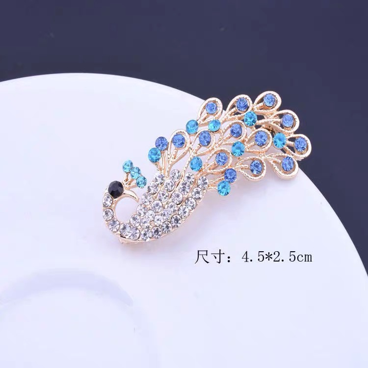 Peacock brooch