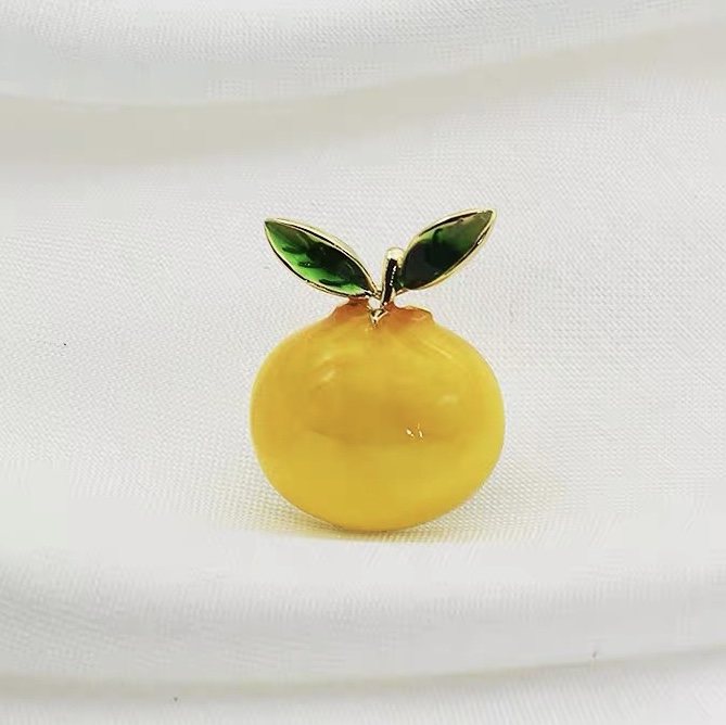 A whole lemon brooch