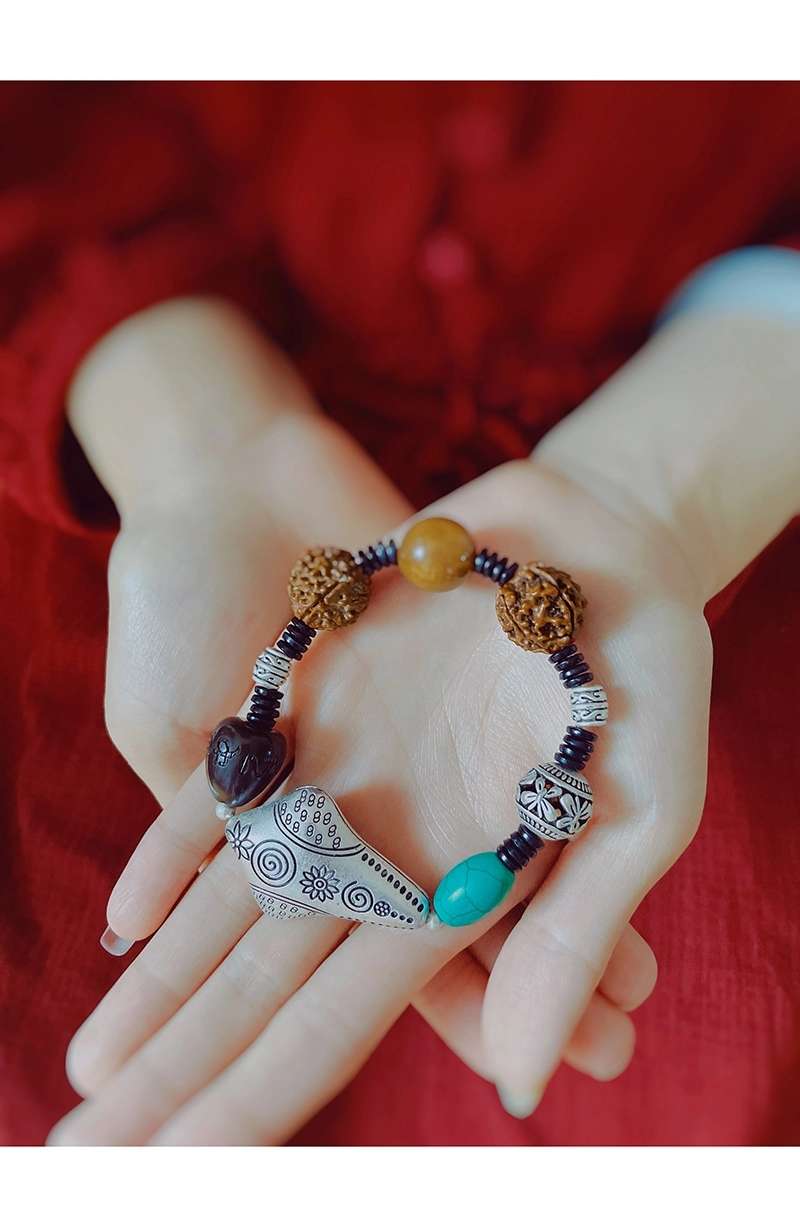 晶珀丽饰品绿松石檀木珠韩国进口弹力线多财多宝藏银手链产品图