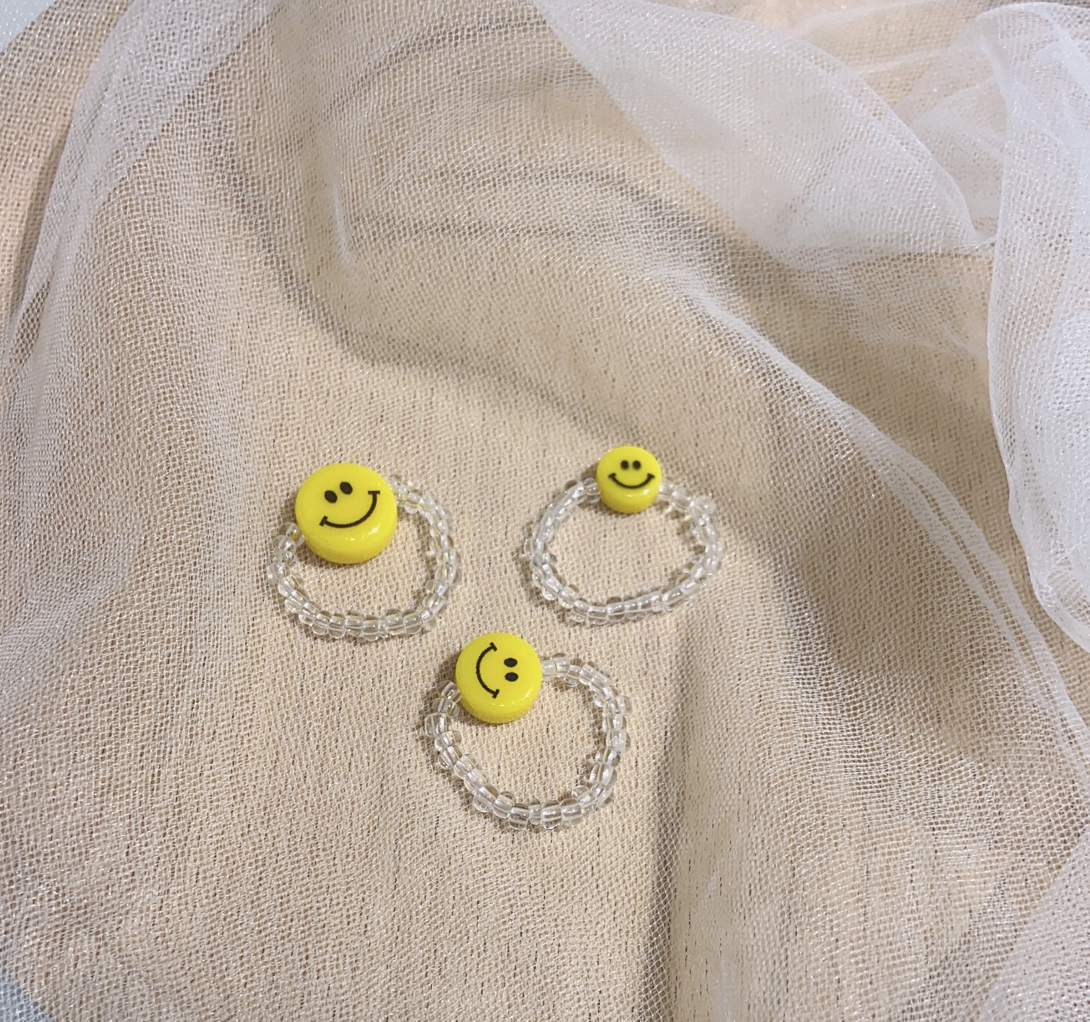 The smiling face rice bead handmade ring can be customized in style Specification image