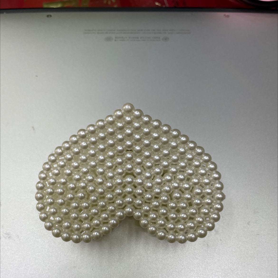 Popular accessory: Pearl heart claw