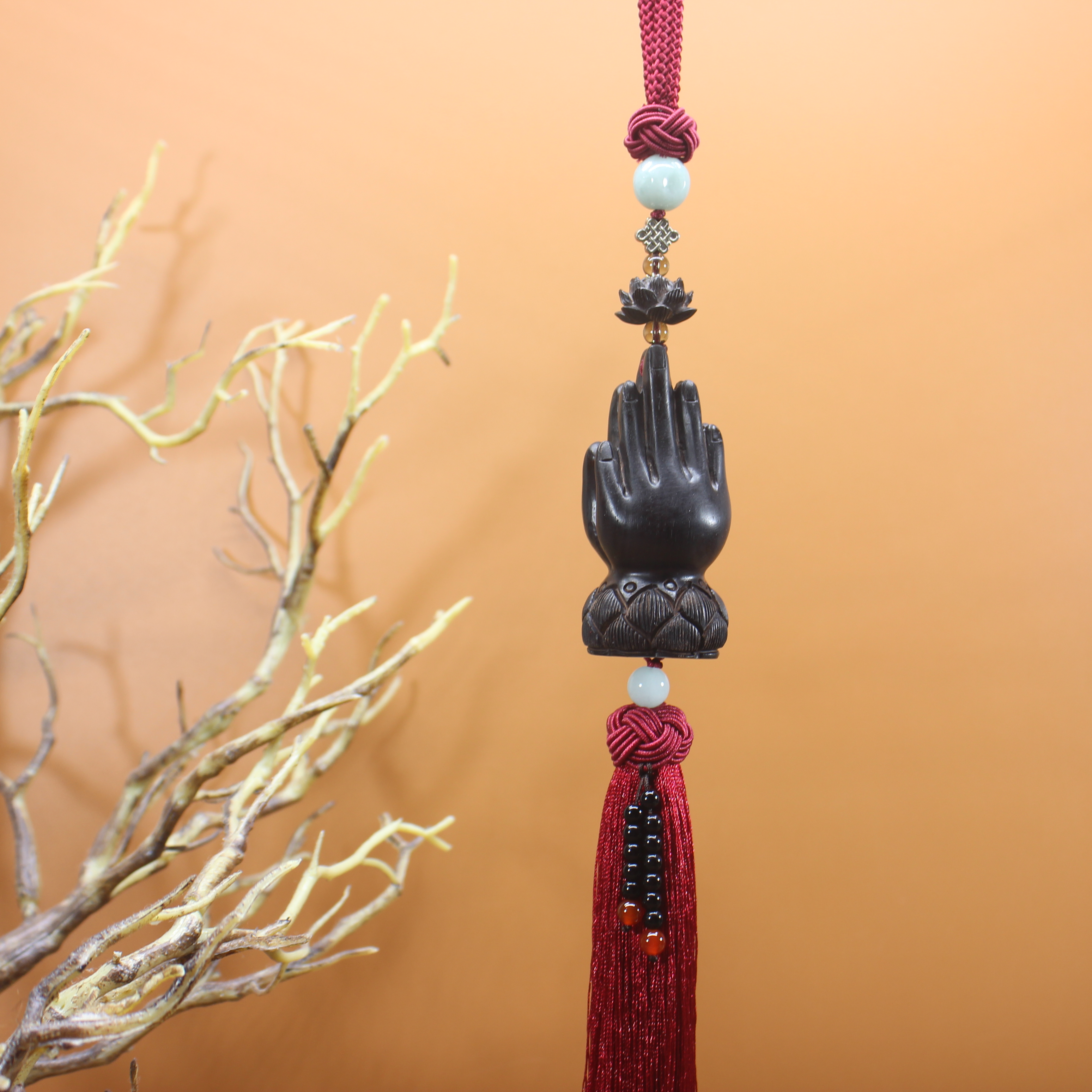 Ebony buddha mano colgante