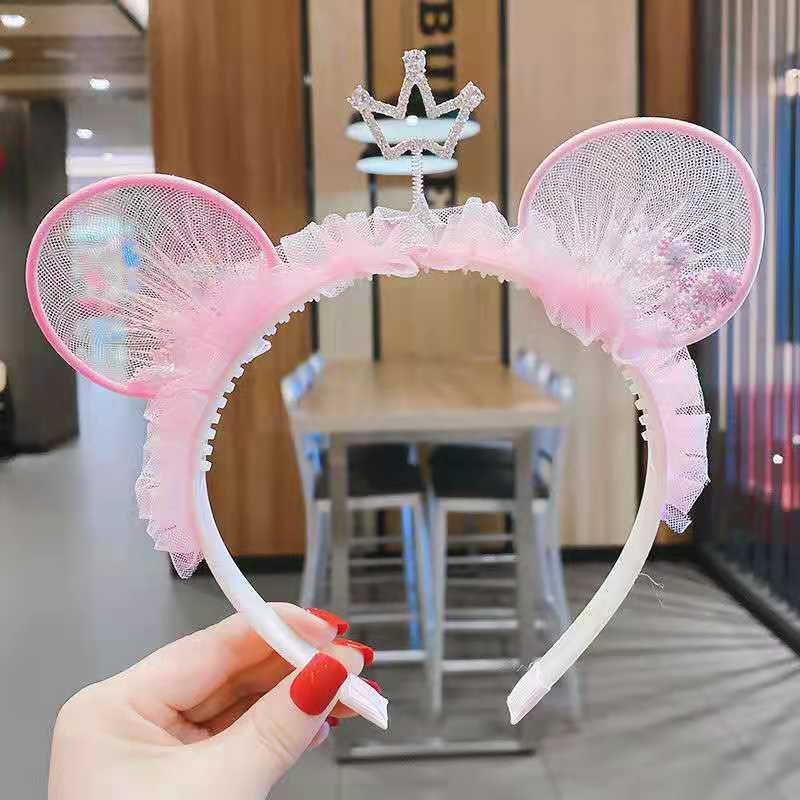 The pink bear ears are three-dimensional