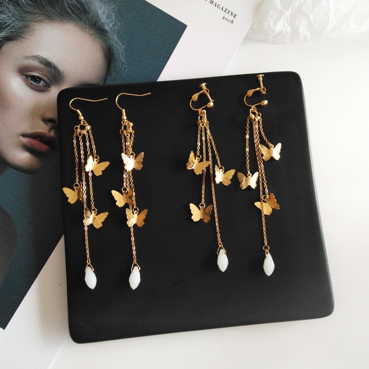 Moda temperamento mujer larga cadena arco pendientes
