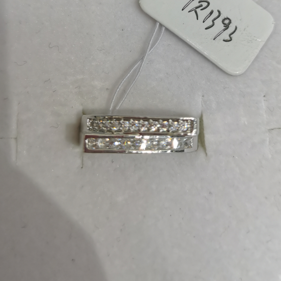 Two white zircon rings